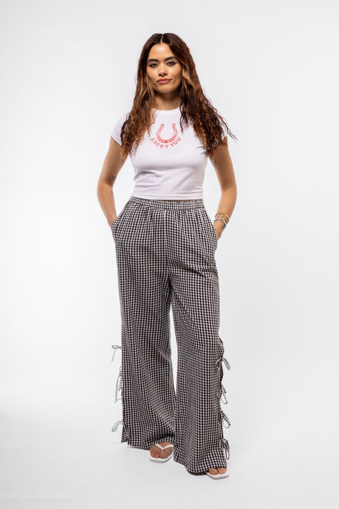 Front view of Lucky You baby graphic tee featuring playful slogan and classic baby tee silhouette

