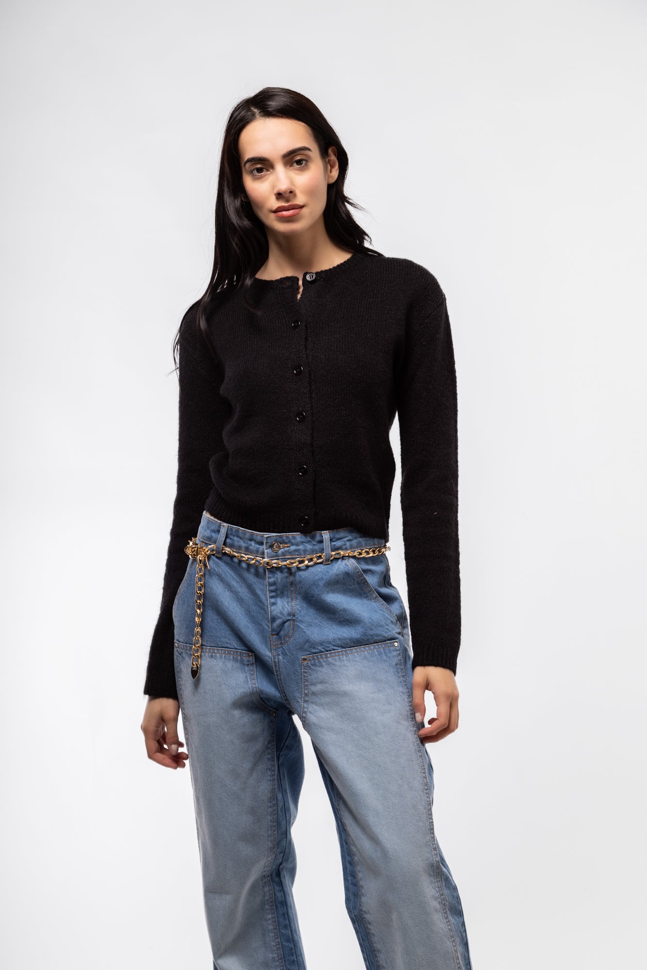 Front view of black crew neck cardigan – classic button-down style

