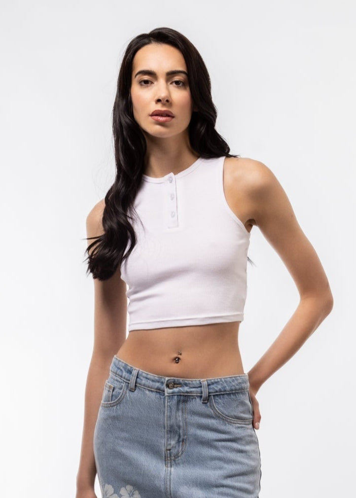 Front view of button placket racer top featuring front buttons and sleeveless racer cut.


