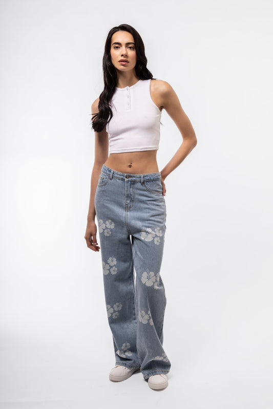Front view of button placket racer top featuring front buttons and sleeveless racer cut.

