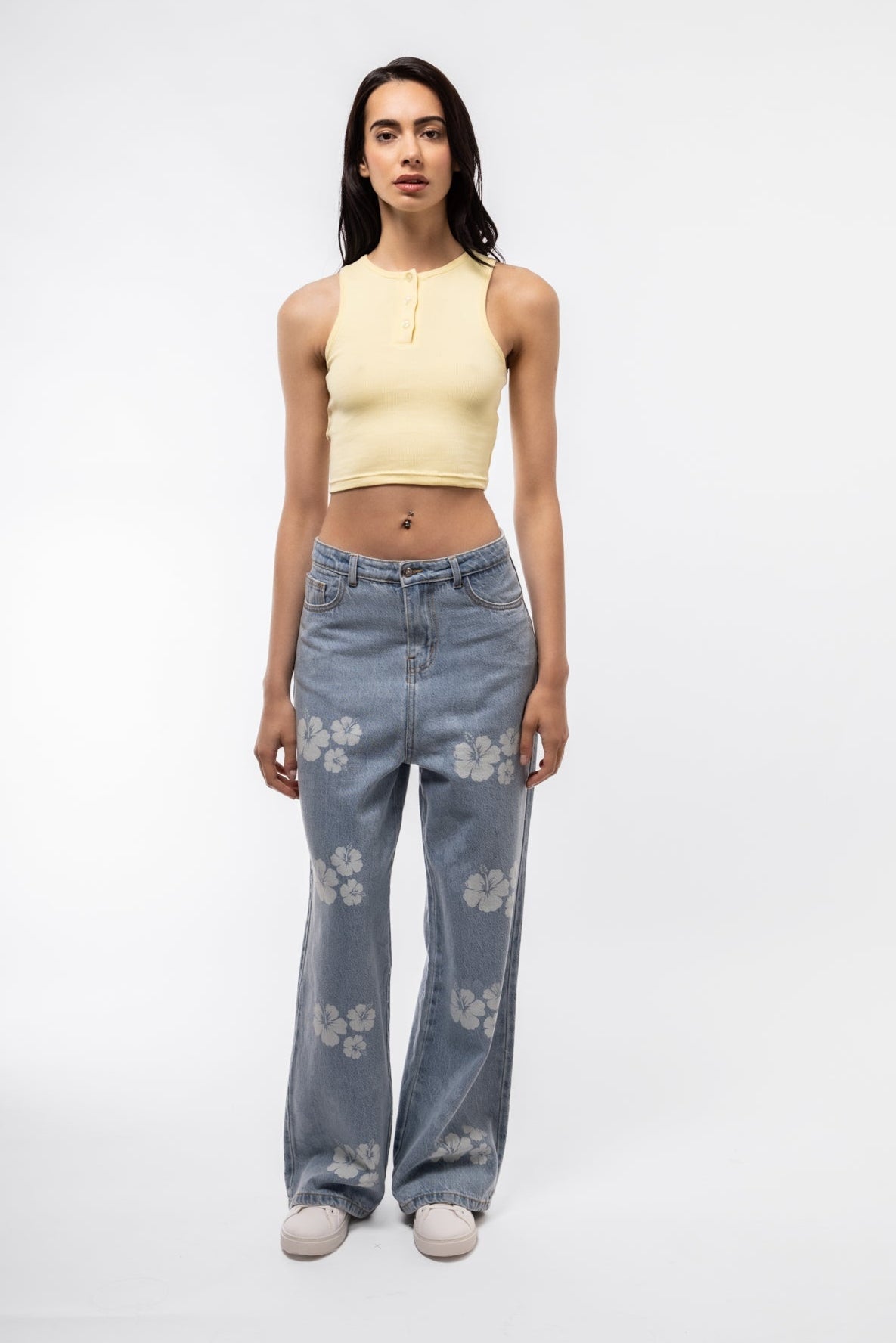 Front view of denim printed wide leg jeans with bold all-over print and relaxed fit.

