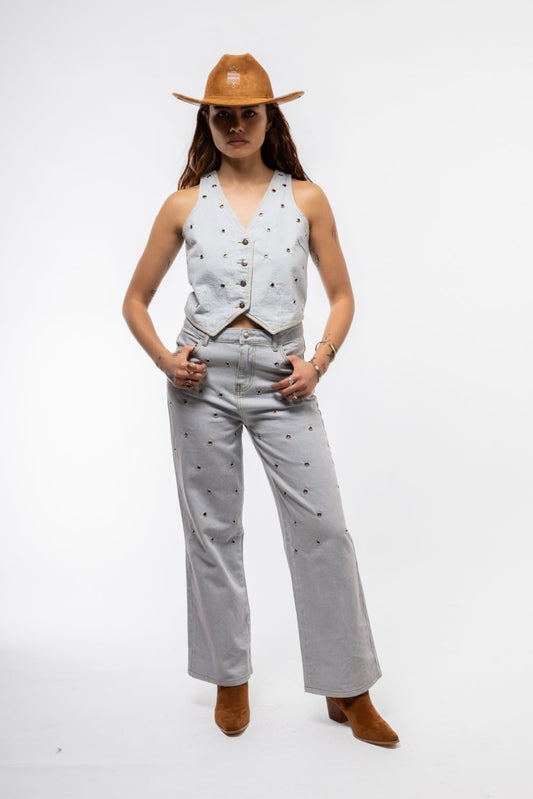 Front view of studded wide leg denim jeans featuring high waist and metallic stud detailing

