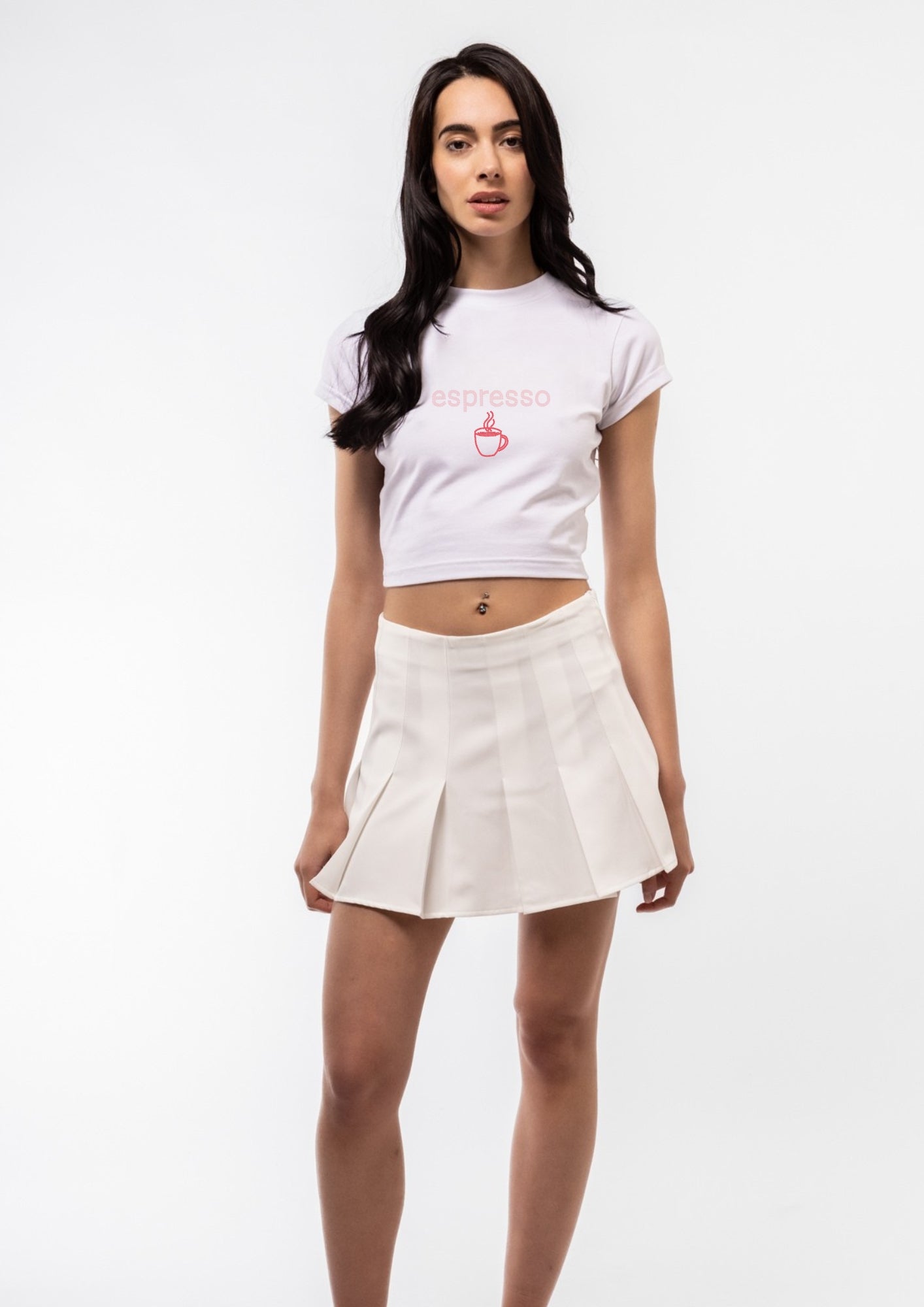 Woman wearing a white t-shirt and skirt on a white background