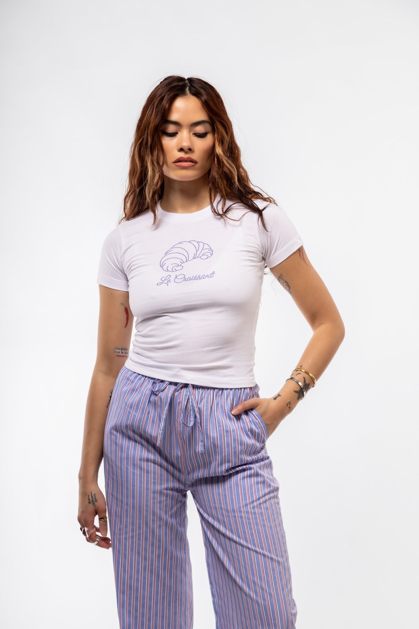 Le Croissant graphic tee front shot showcasing rhinestone-embellished croissant illustration and classic crewneck fit

