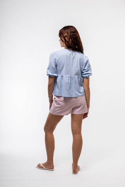 Pastel blue cropped puff-sleeve top with adjustable front knot