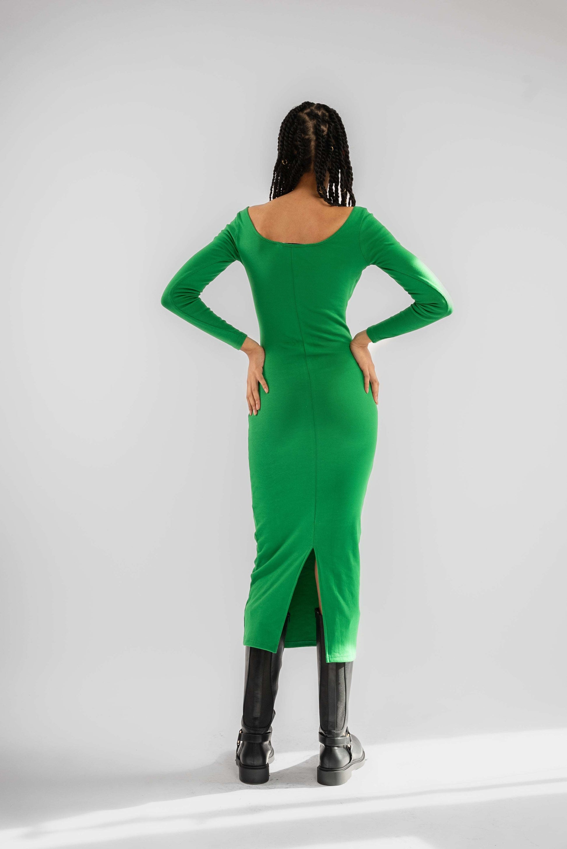 a woman wearing a abundant green dress from silkroad daughters 