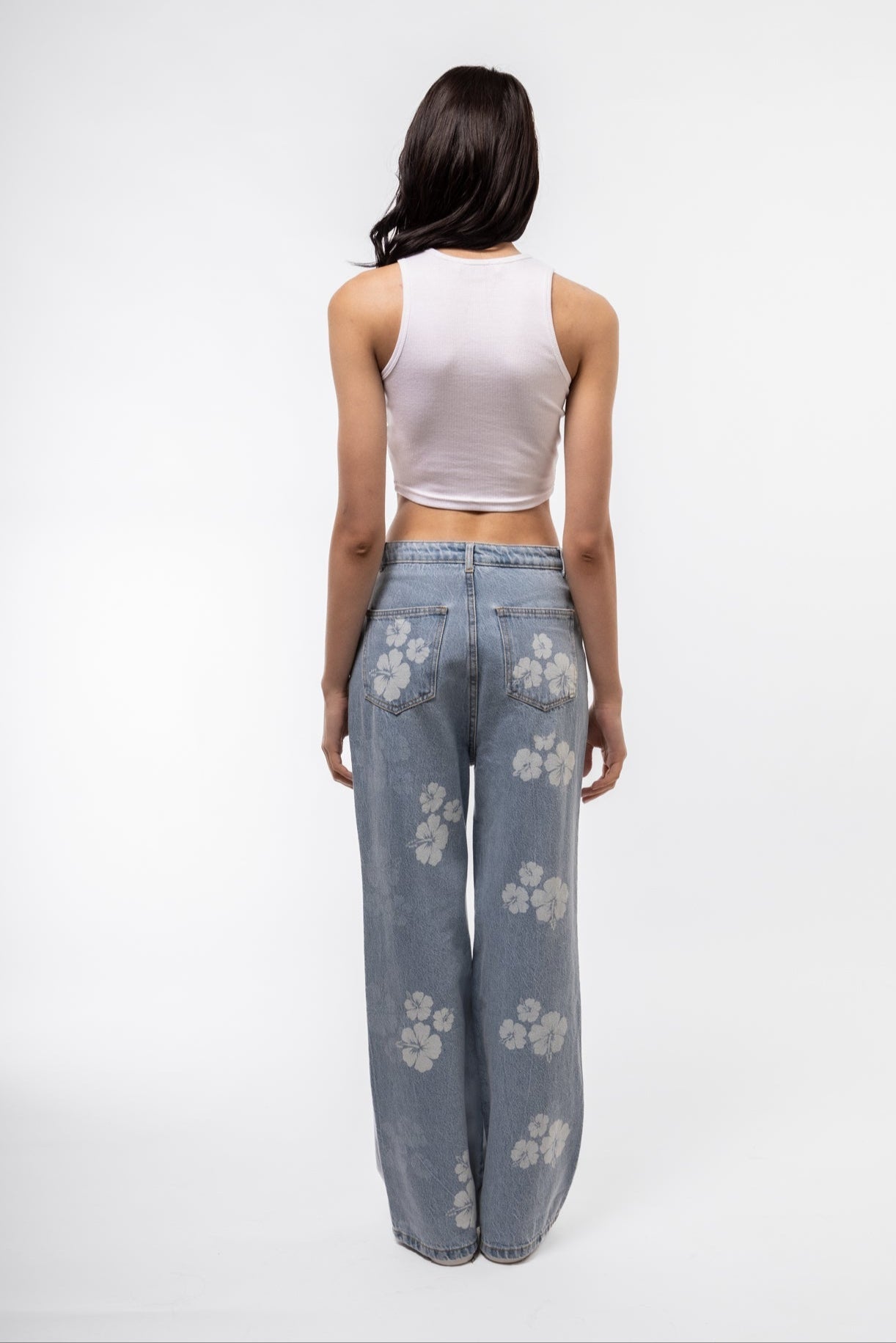 White racer tank back profile showing soft rib knit and sporty shape.

