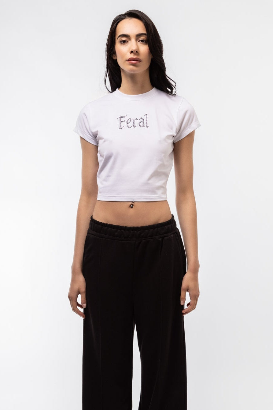 Close-up front image of Feral baby tee highlighting shimmering rhinestones and snug crewneck fit


