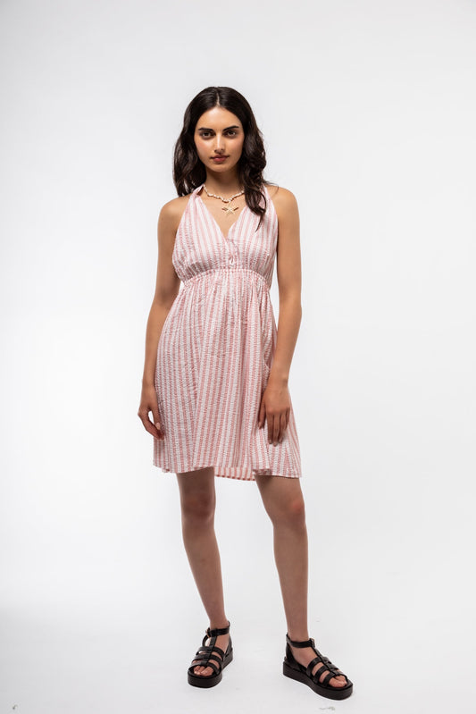 Close-up front image of halterneck dress highlighting fabric texture and decorative side bow

