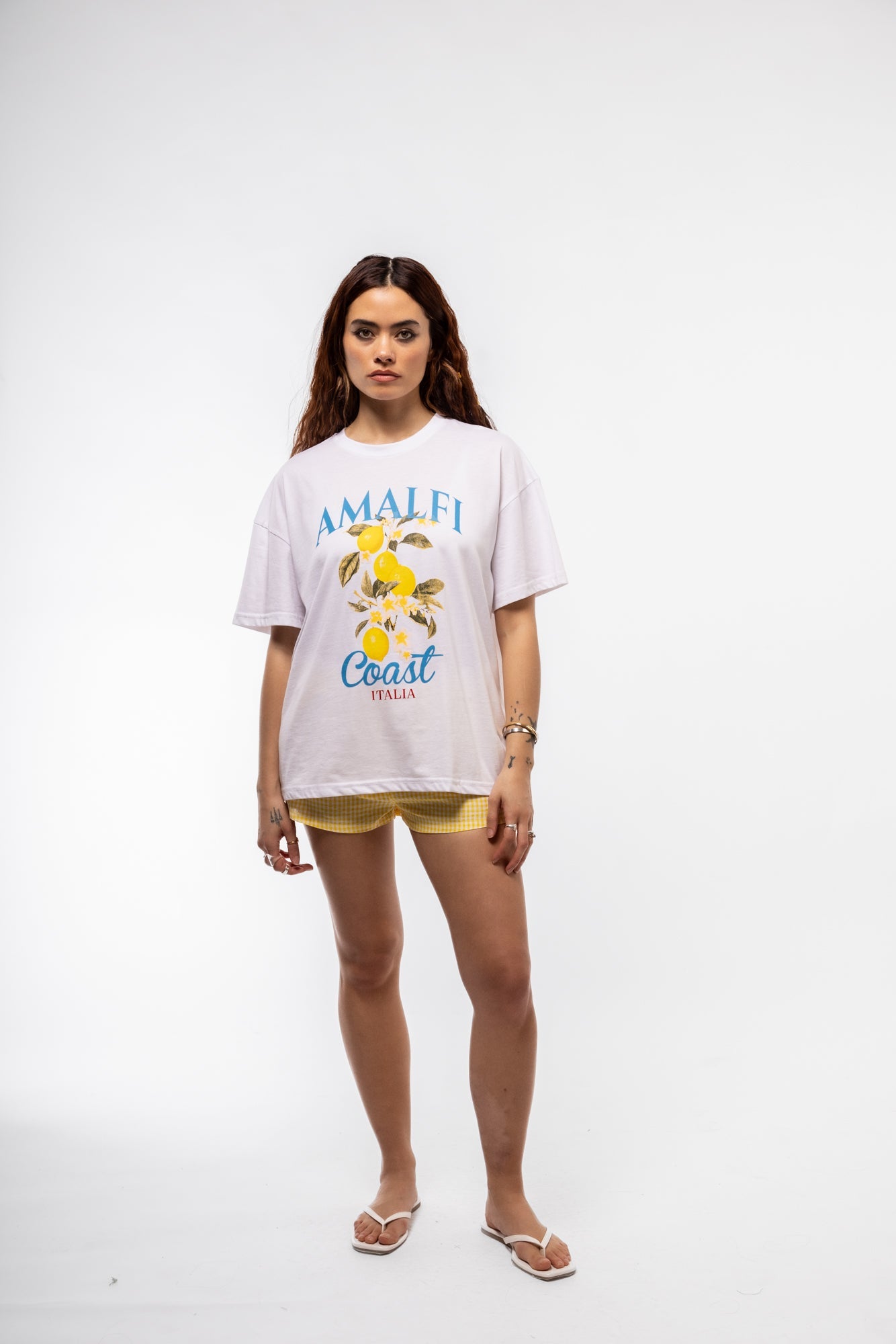 Model Front view of butter yellow high-waisted shorts – summer essential