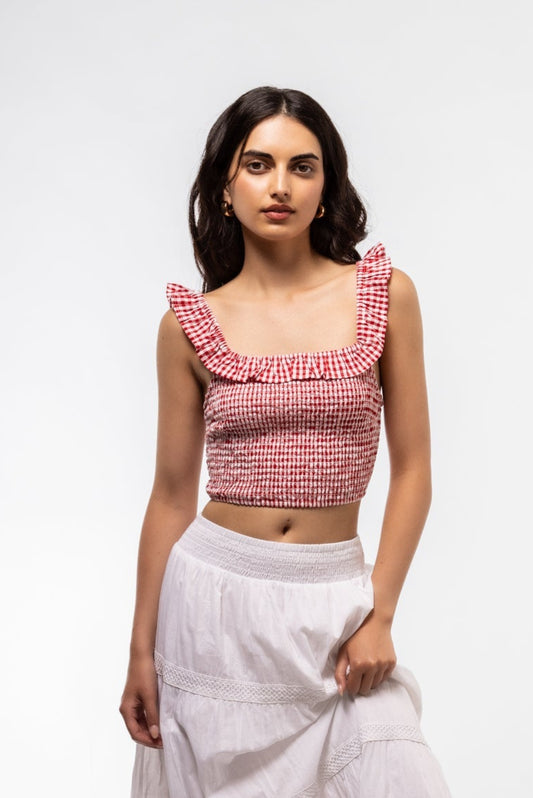 Front view of checked ruffle top – feminine fit with flared detail

