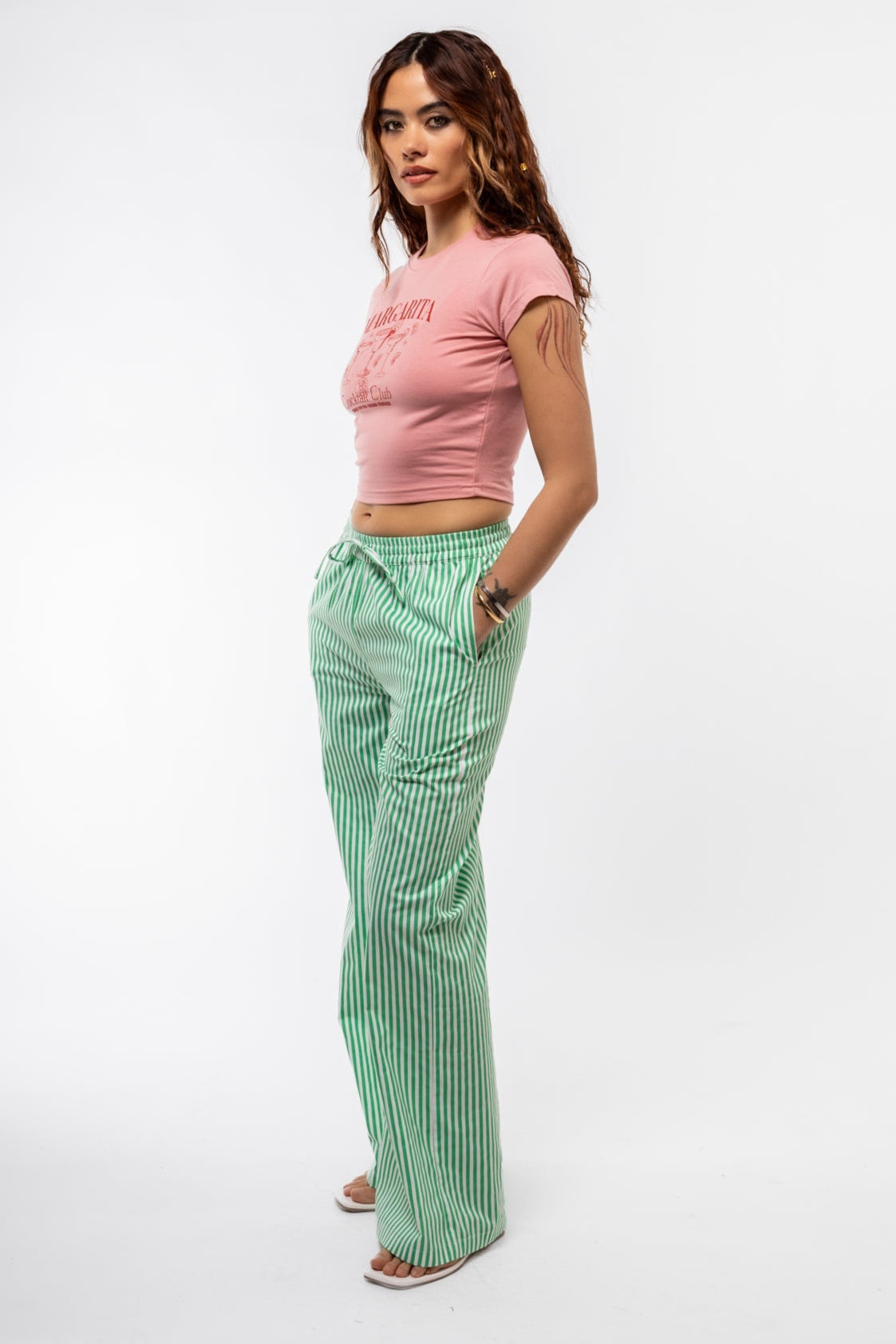 Model Margarita graphic t-shirt side view emphasizing lightweight fabric and laid-back silhouette

