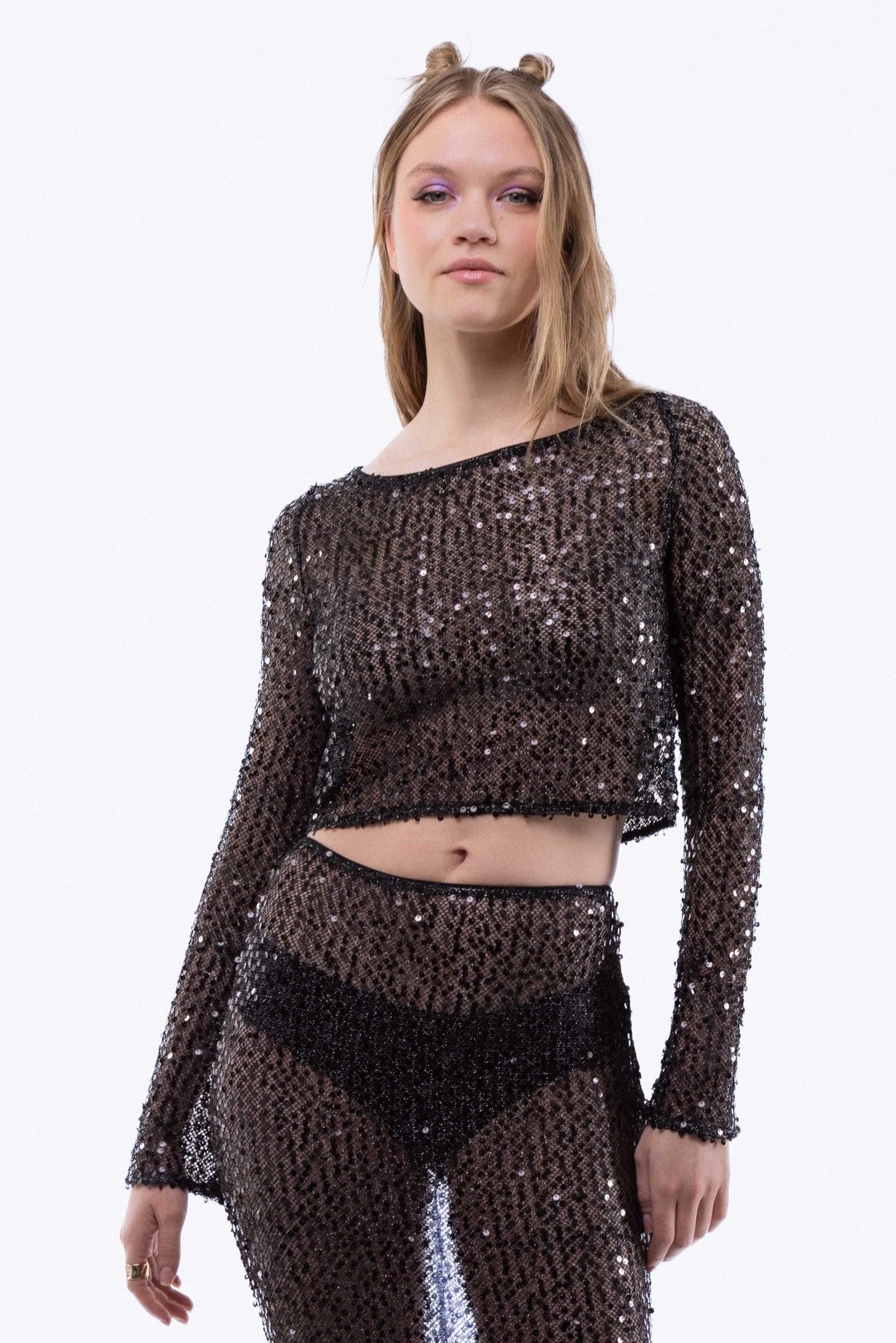 Model wearing Sparkly sequin-embellished crochet knit top – sleeveless front view

