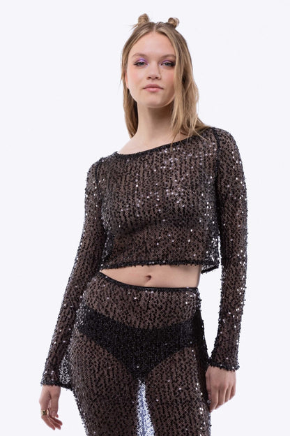 Model wearing Sparkly sequin-embellished crochet knit top – sleeveless front view

