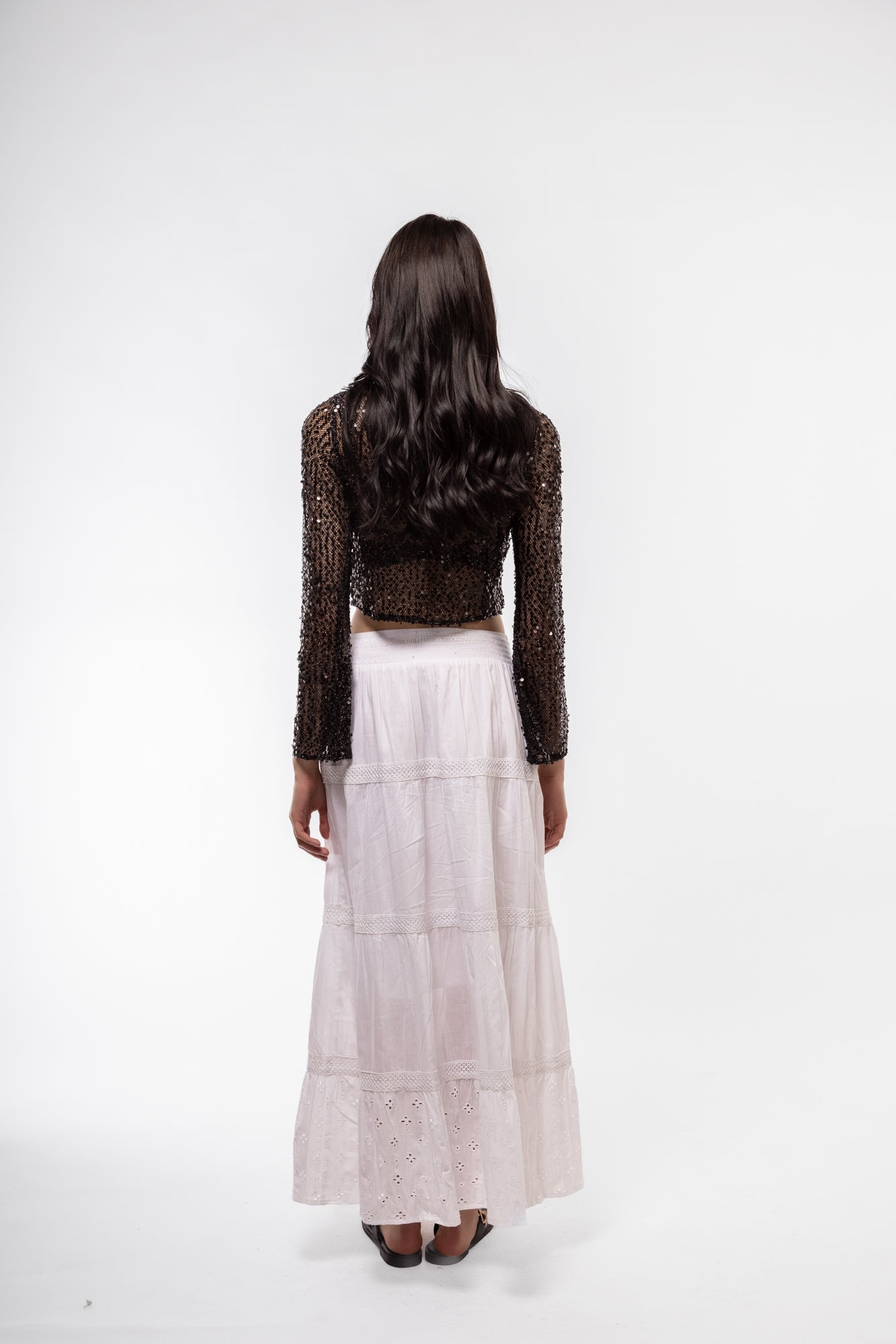 Model from the Back view of sequin crochet knit top – shimmering and breathable

