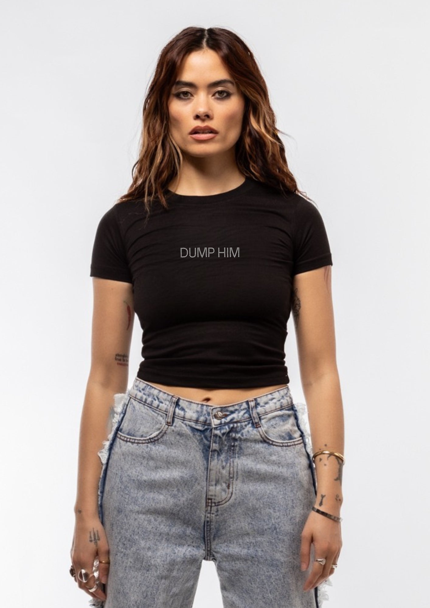 Model  wearing a black t-shirt with 'DUMP HIM' text on a white background