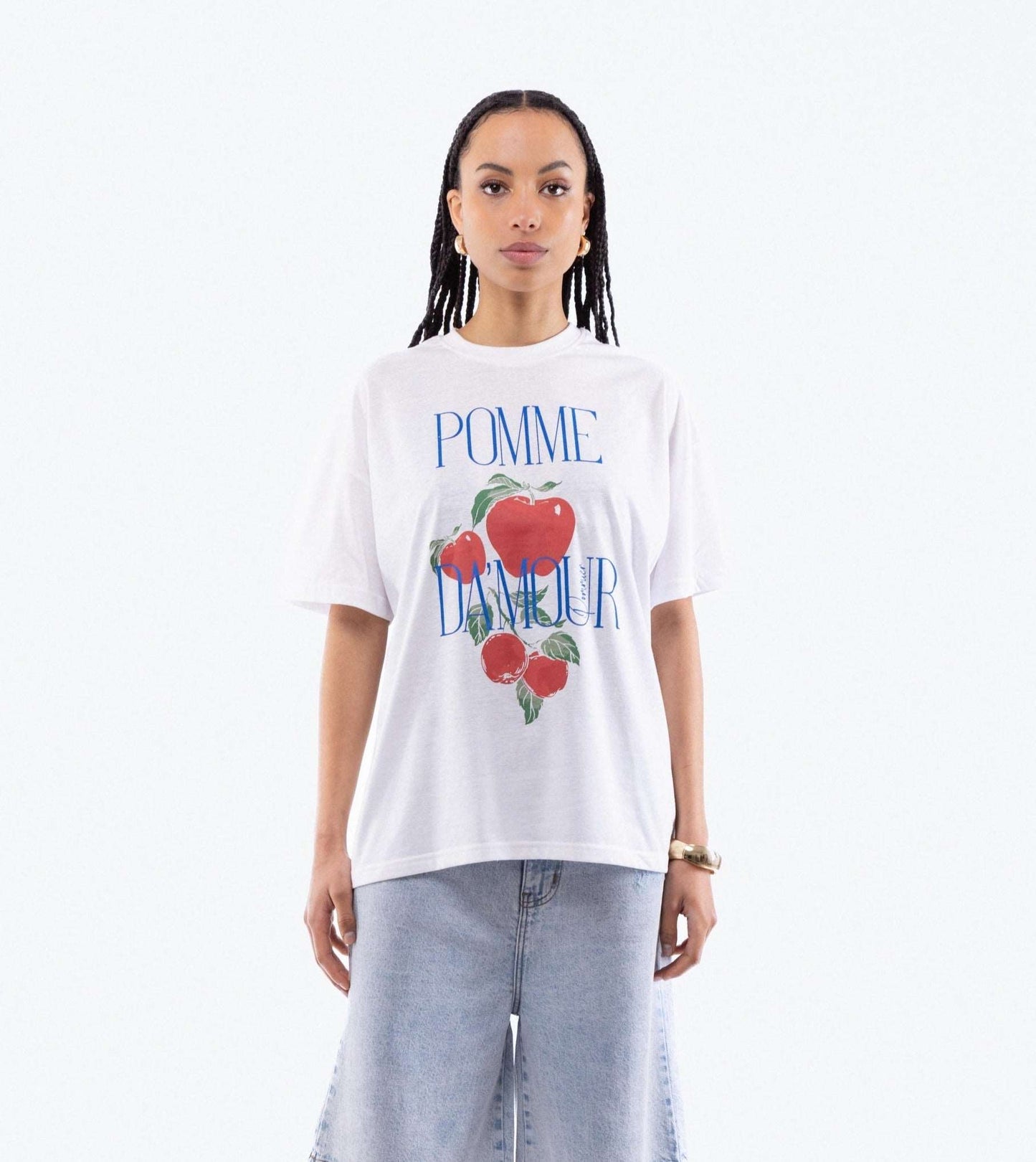 a woman in a oversized tee posing with a graphic print  top from silkroad daughters