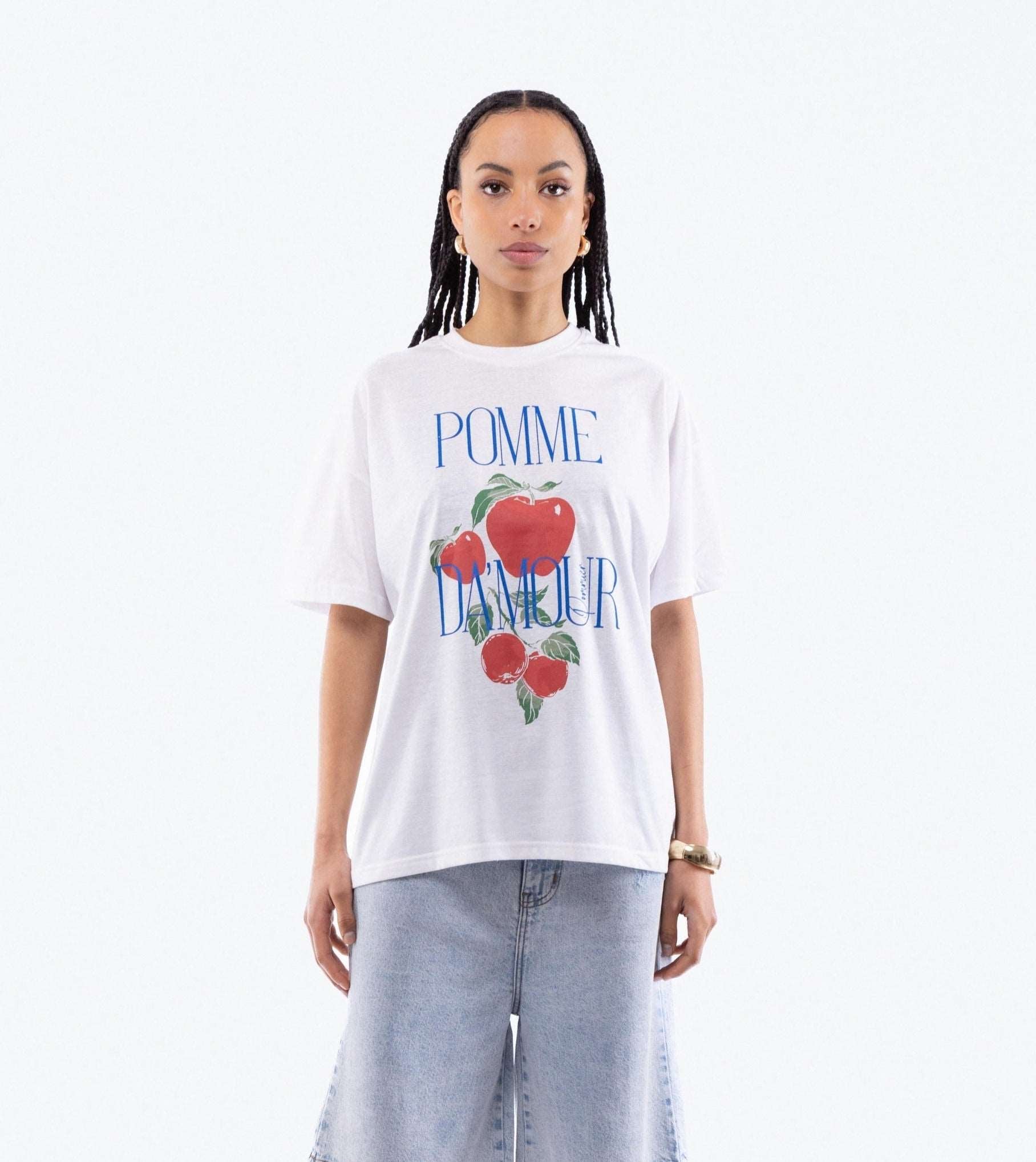 a woman in a oversized tee posing with a graphic print  top from silkroad daughters