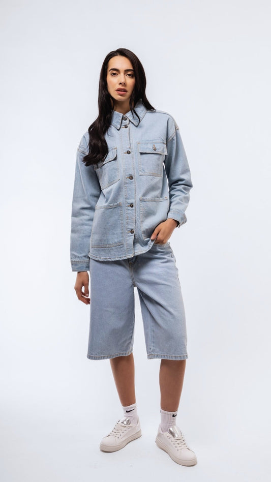 Oversized longline shirt in denim wash front view with clean button details.

