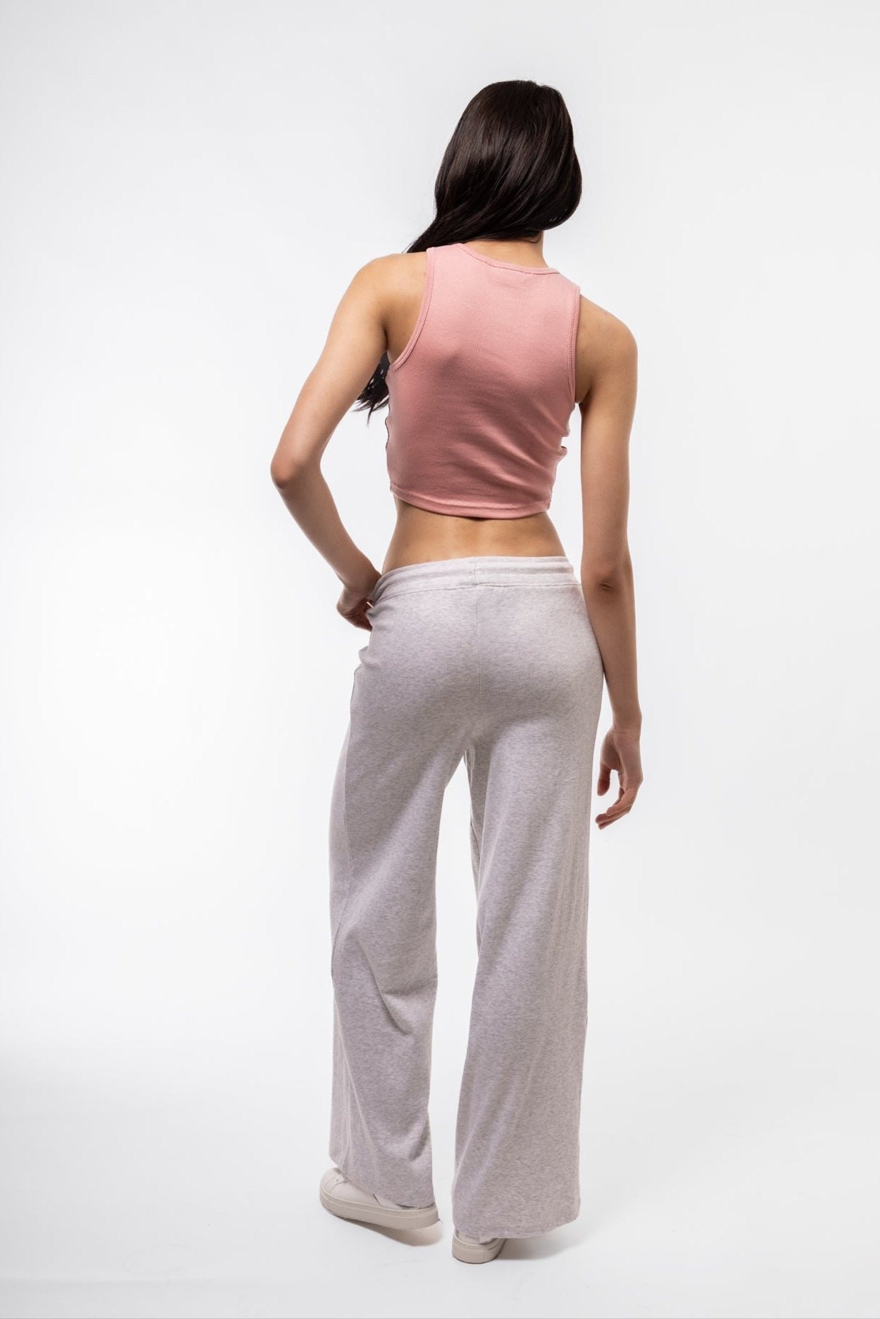 Pink racer top back profile with soft rib knit and clean seam lines.

