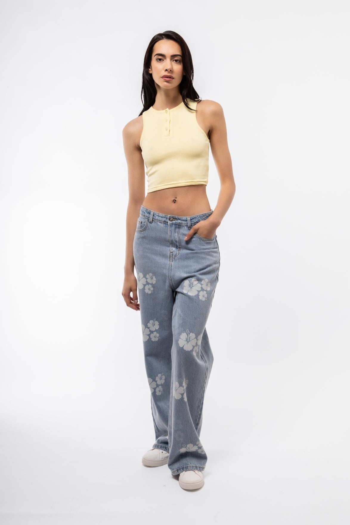 Printed denim wide leg jeans front shot with structured waistband and flared silhouette.

