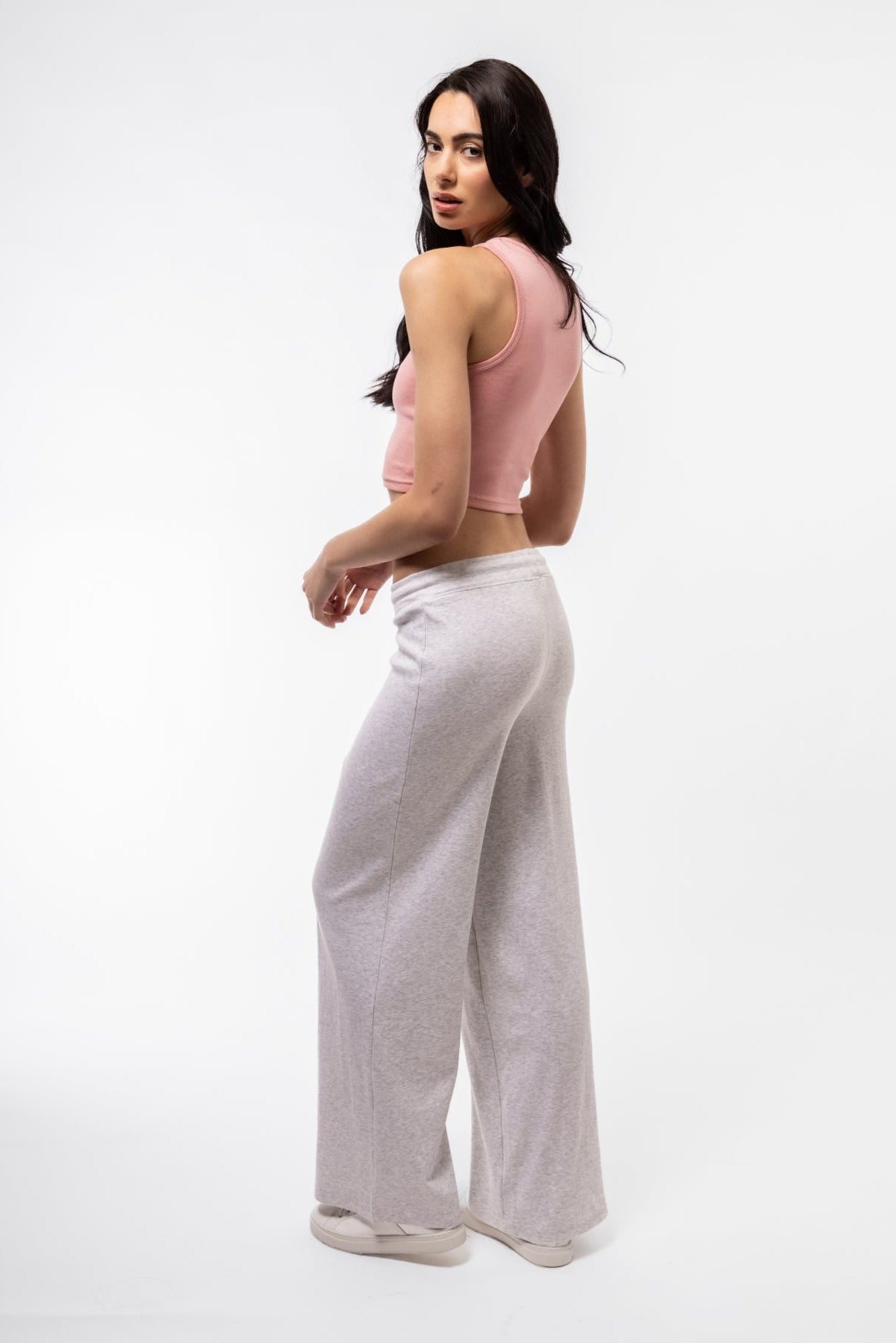 Rear image of light pink racer top featuring cropped back and slim cut.

