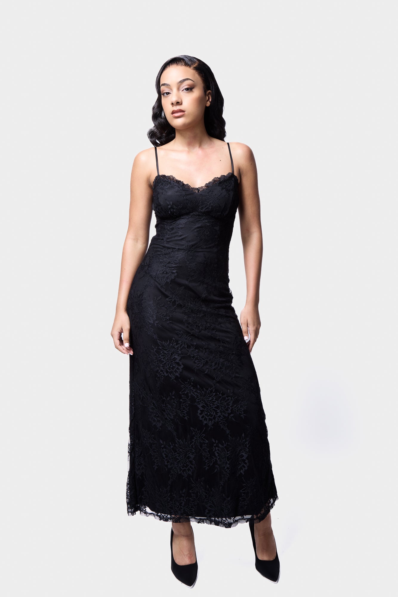 Romantic lace midi slip dress with adjustable straps and sheer lace overlay
