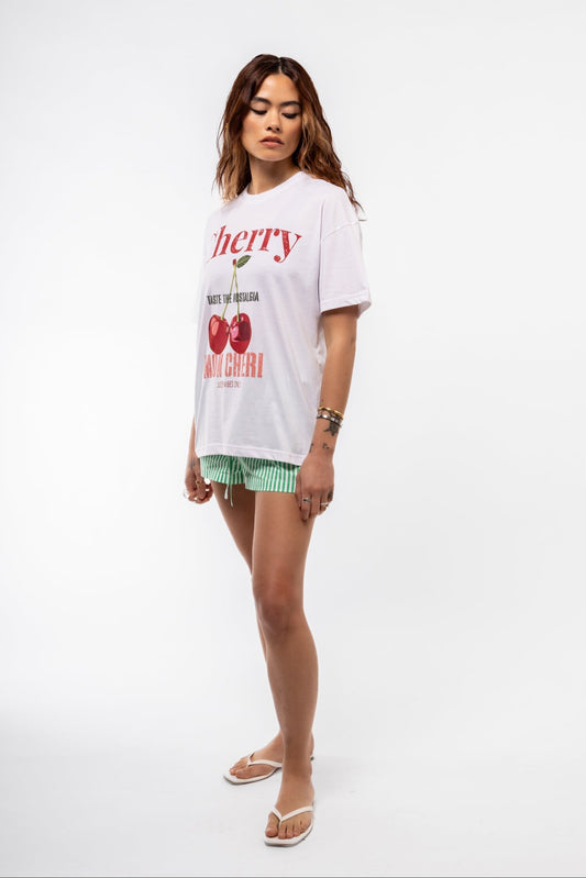 Side profile of Cherry oversized tee showing slouchy fit and partial view of bold cherry graphic

