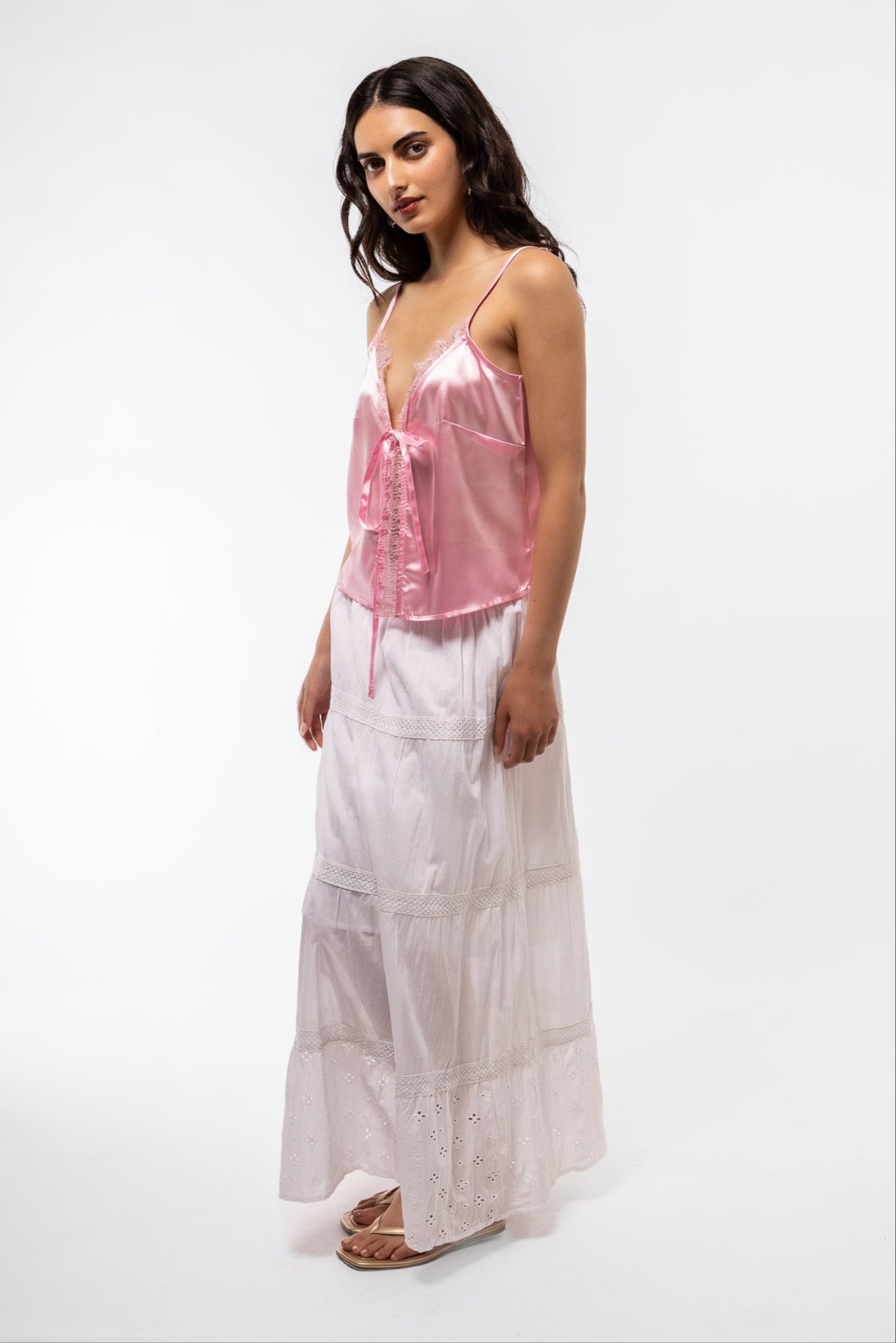 Side view of the Candy pINK SATIN top with lace detailing 