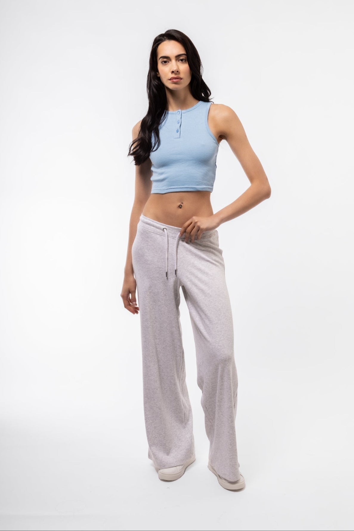 Sky blue button placket racer top featuring high neckline and slim fit.

