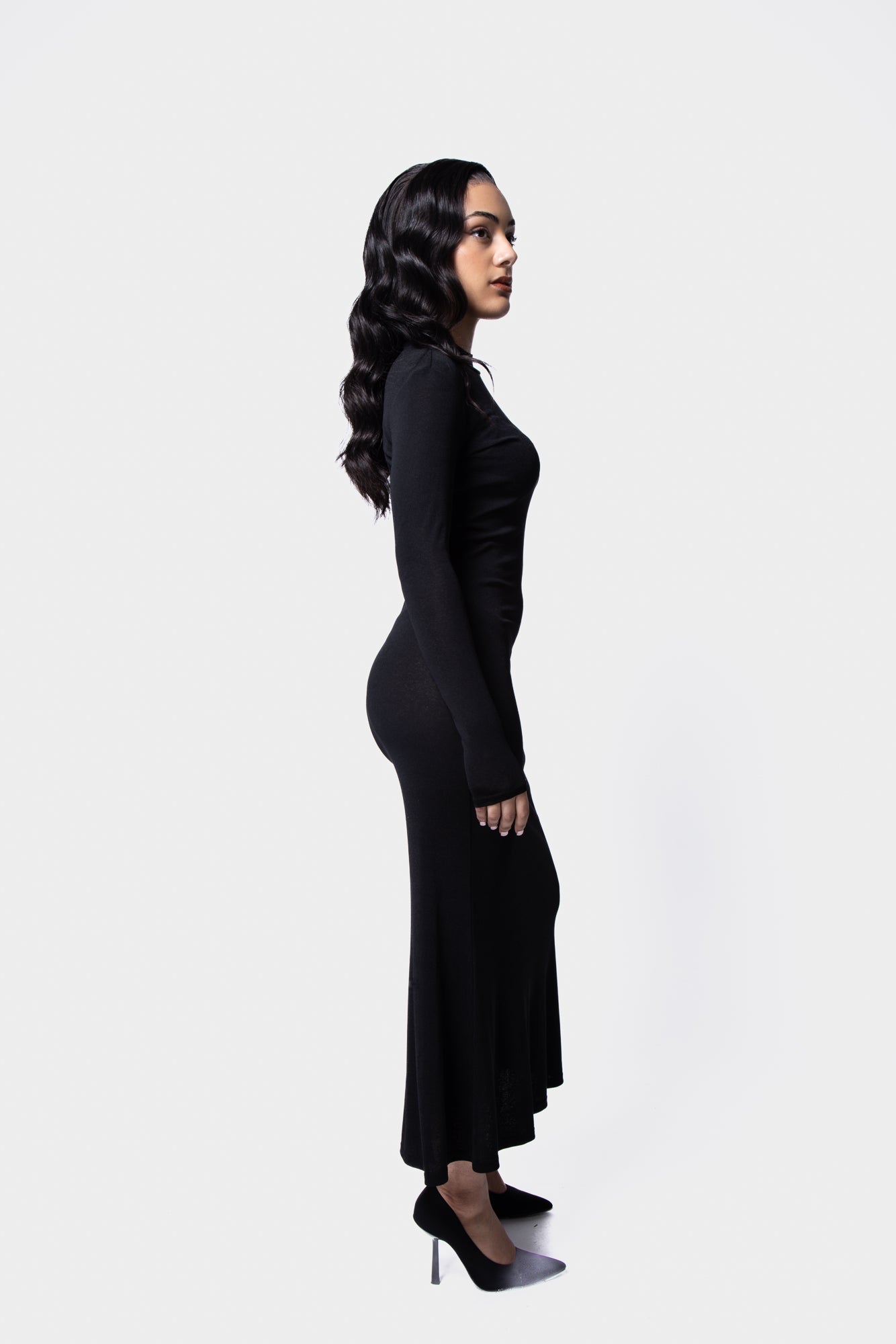 Sophisticated knit maxi dress with sheer elements and long sleeves side view 