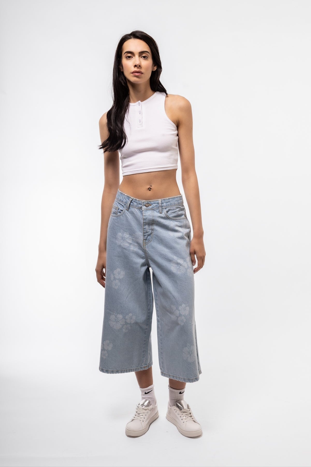 Statement longline denim jorts with custom print design and relaxed fit, front image.

