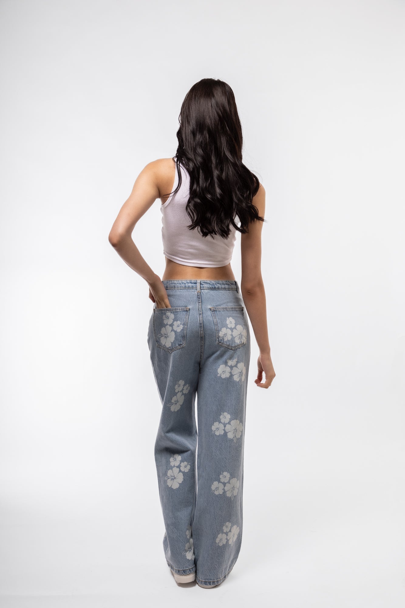 White racer tank back profile showing soft rib knit and sporty shape.

