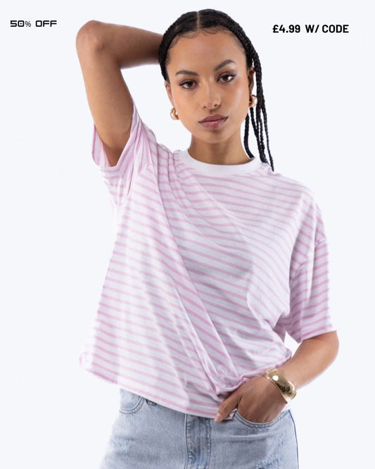 Woman wearing a pink and white striped t-shirt with text indicating a discount on a white background