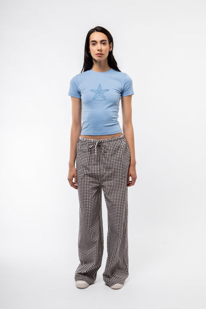 Women’s black check trousers in gingham pattern, front-facing image showing tailored fit.


