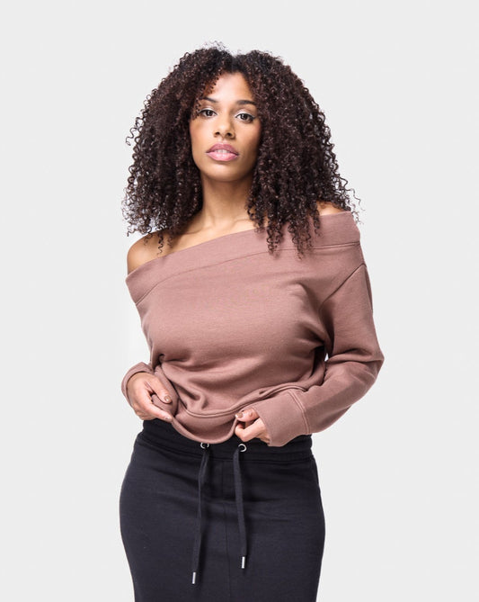 Women’s black midi skirt featuring a front slit and comfortable elastic band, perfect for everyday streetwear.