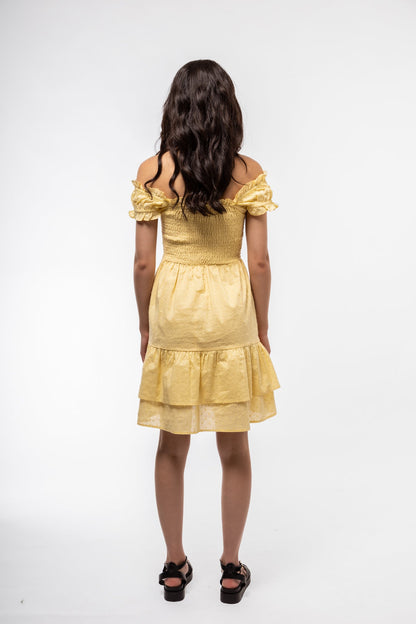 Women’s smocked back dress in butter yellow, back view showing airy and flattering design.

