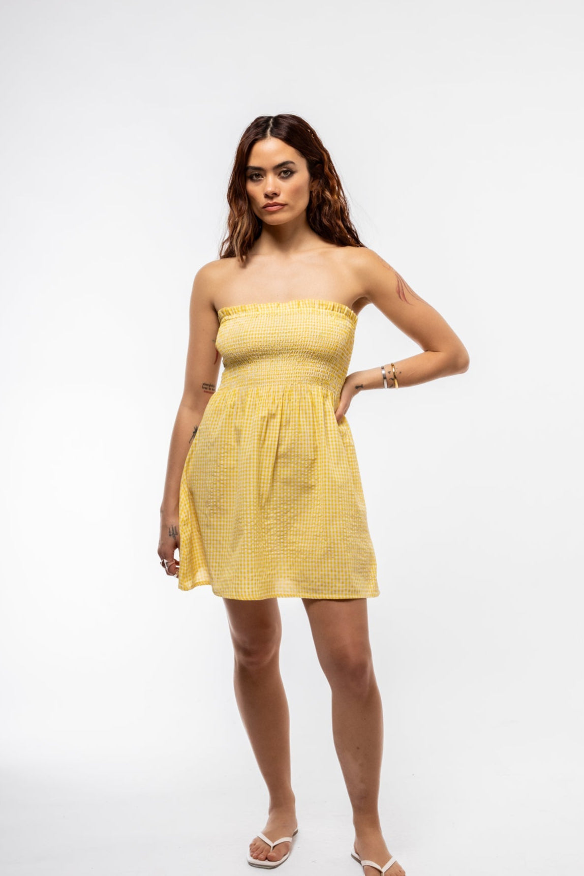 Women’s strapless ruched mini dress in soft yellow gingham pattern

