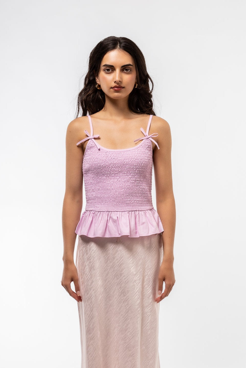 close up of the shirring bow tank top with model 