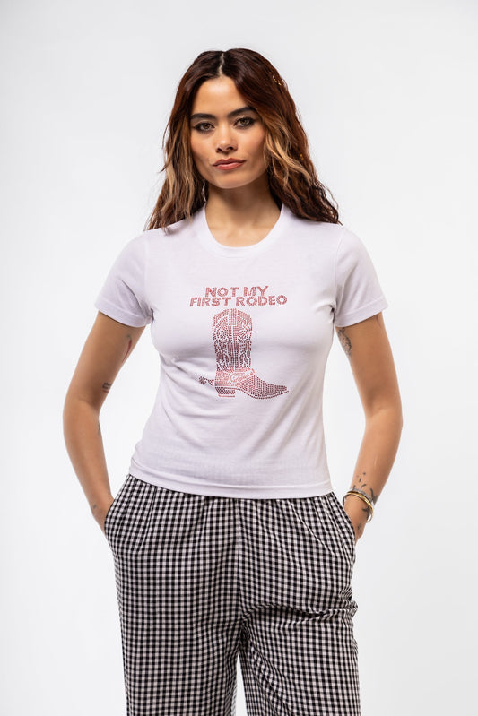model Front view of “Not My First Rodeo” rhinestone tee featuring sparkling text and cowboy boots graphic