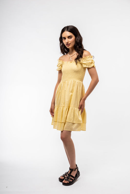 Front view of butter yellow shirred tea dress with puff sleeves and soft square neckline.

