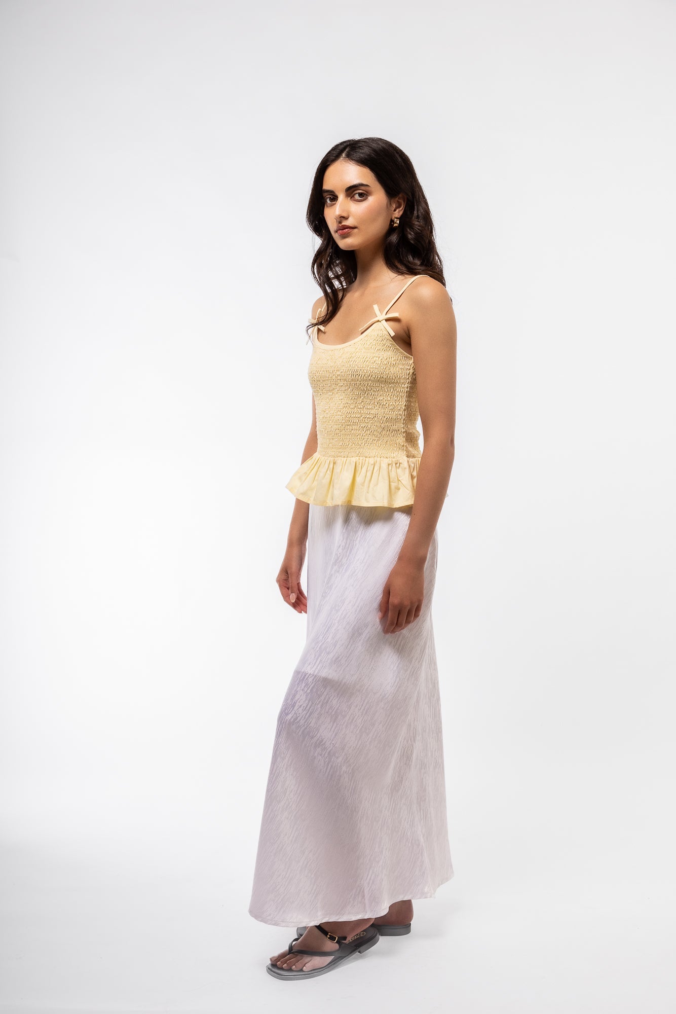 side profile image of the lemon yellow shirring tank bow top 
