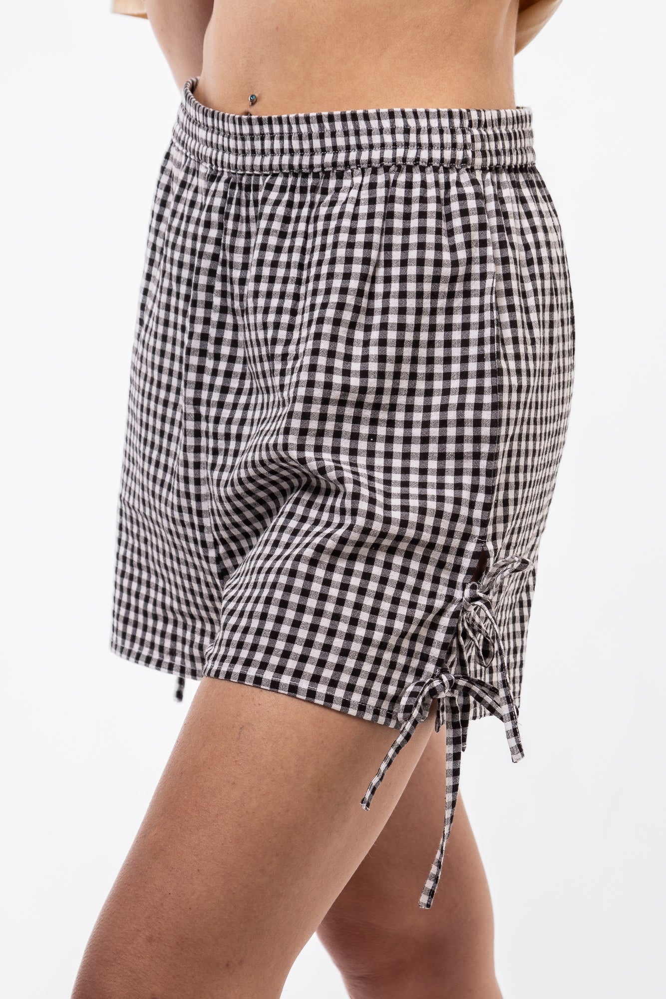 side view of the  black gingham shorts y2k 