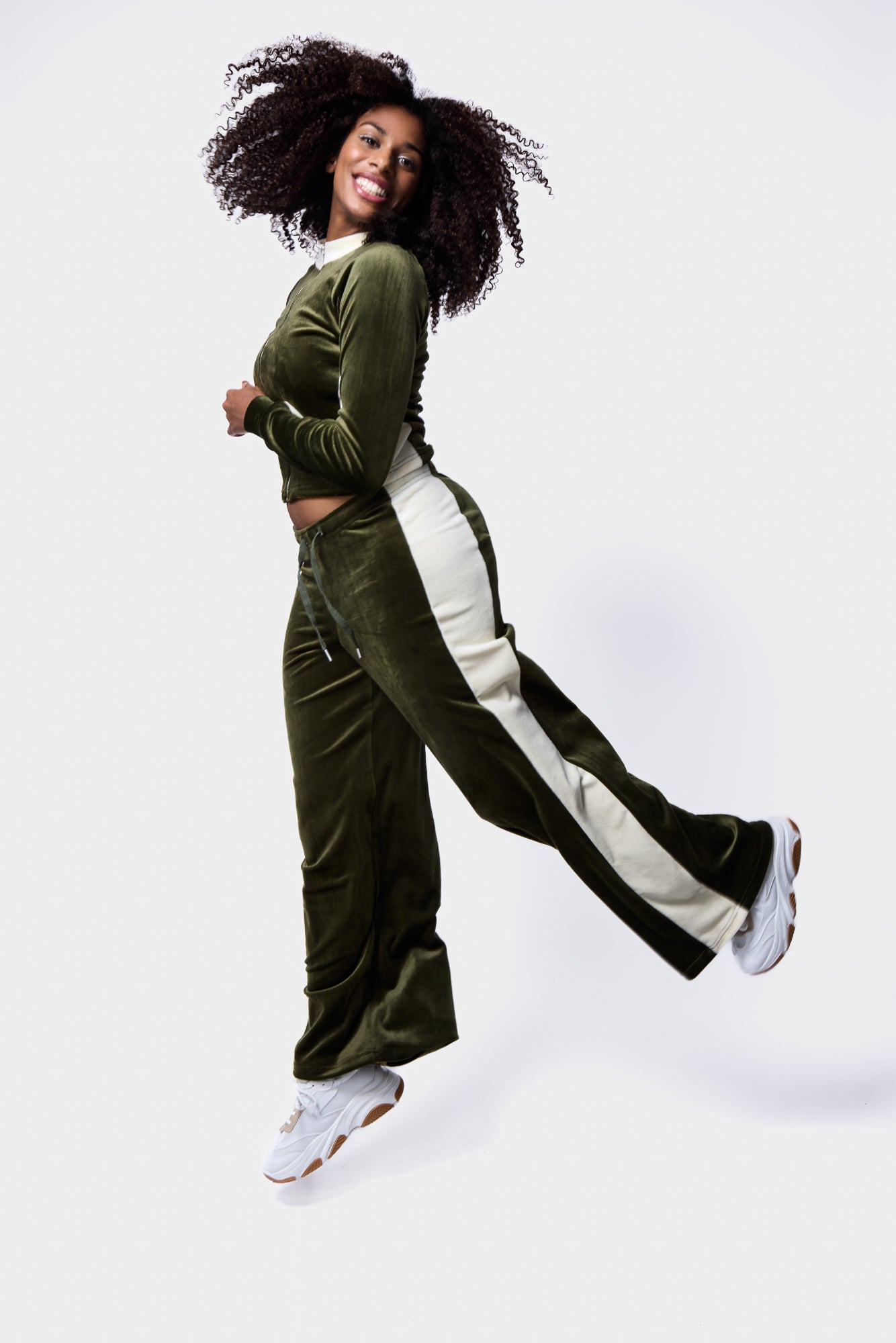 Green velour tracksuit featuring white contrast stripe